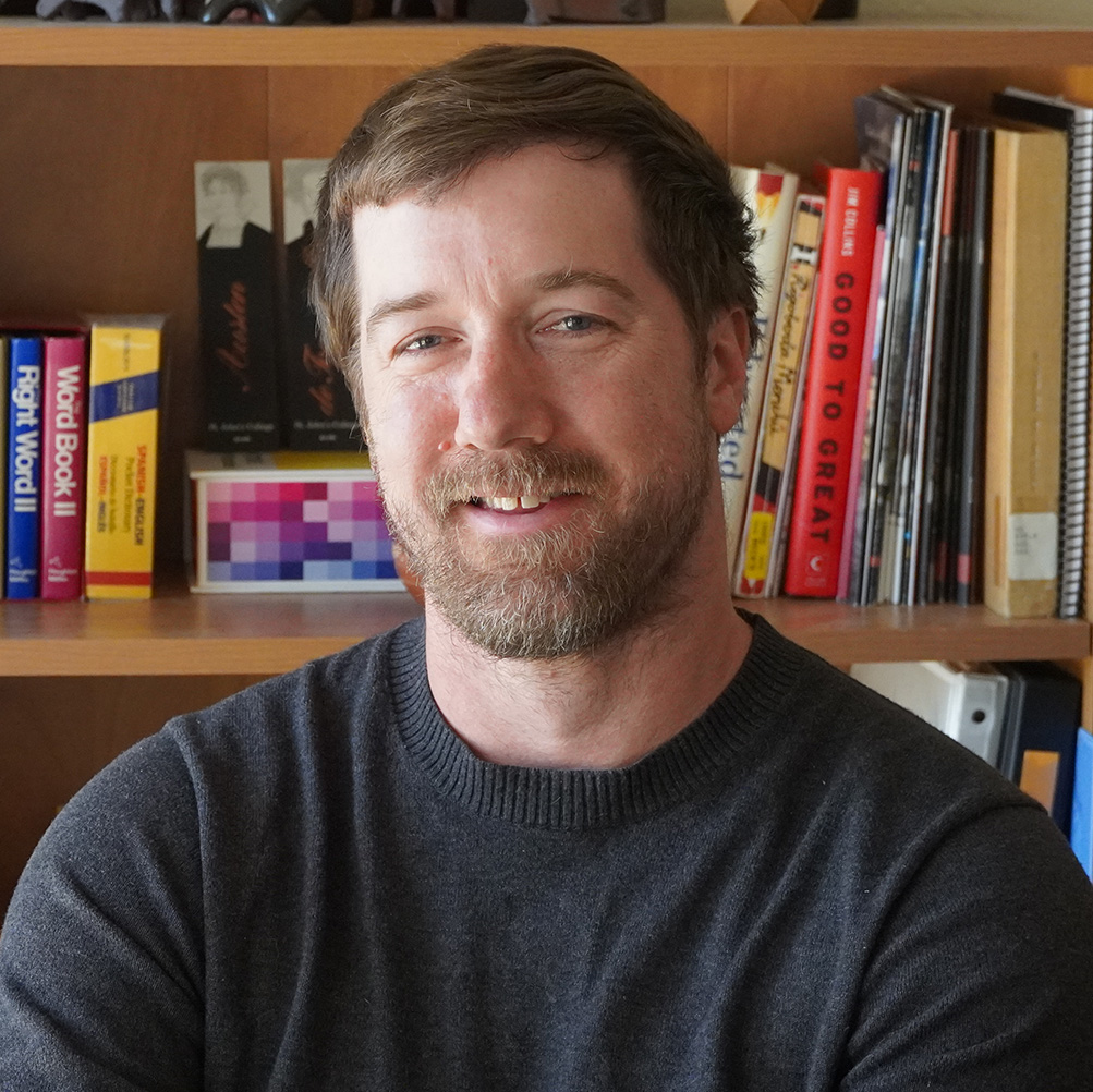 Michael Harper wearing a gray shirt